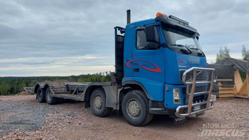 Volvo FH12 8x4 Forest machine transport trucks