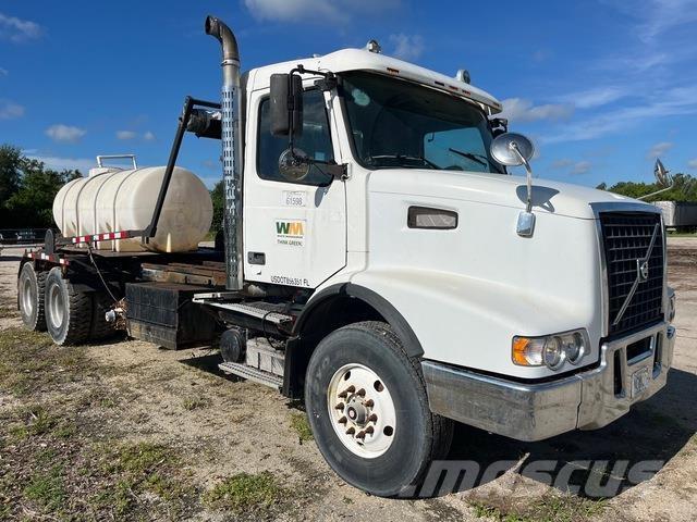 Volvo VHD64 Skip loader trucks
